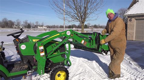 skid steer quick attach vs jd